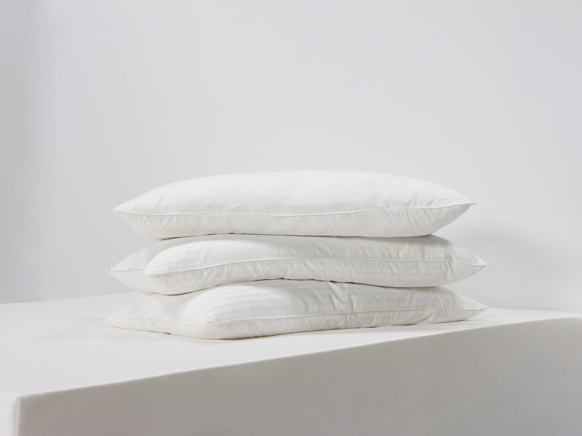 Three king down pillows side view